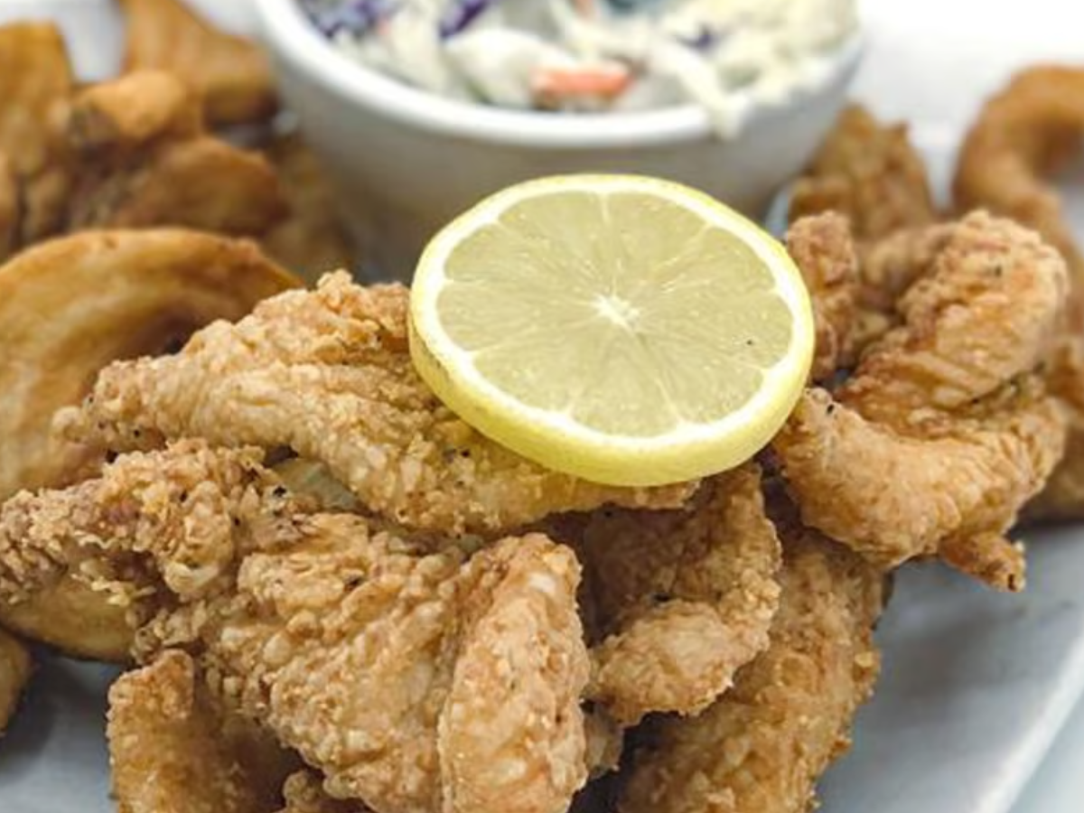 Fried flounder fingers with craft beer battered fries and tropical slaw